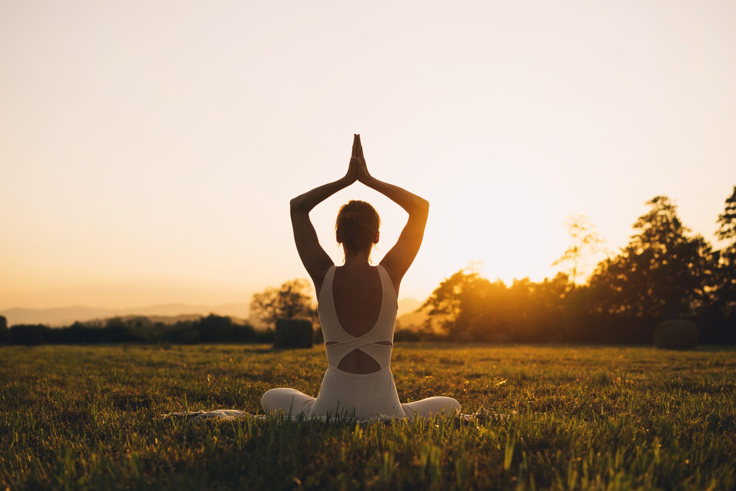 Young,Woman,Practicing,Yoga,On,Nature.,Girl,Meditating,Outdoors.,Female